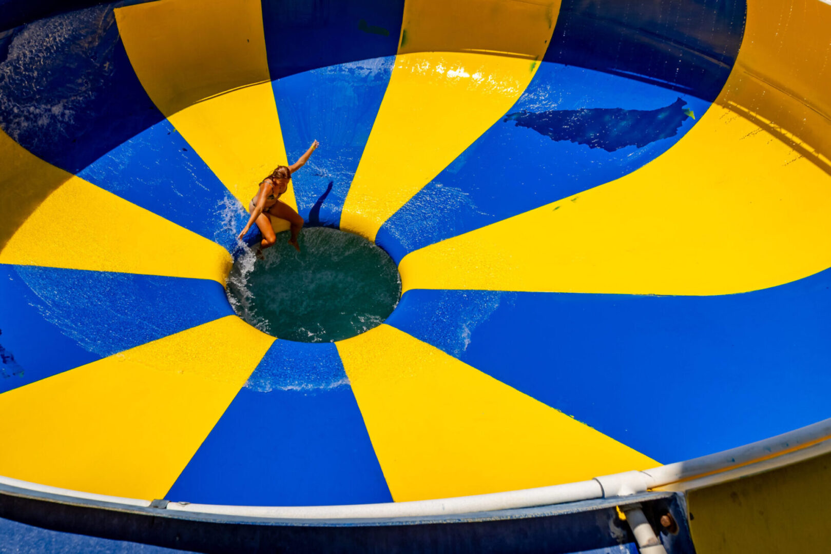 Person sliding on colorful water slide