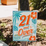 21 and Over" tropical-themed sign outdoors.